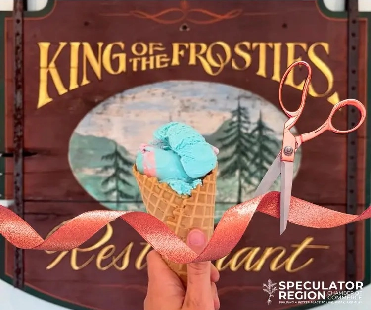 An ice cream cone and a ribbon in front of the entry sign to celebrate their grand opening!