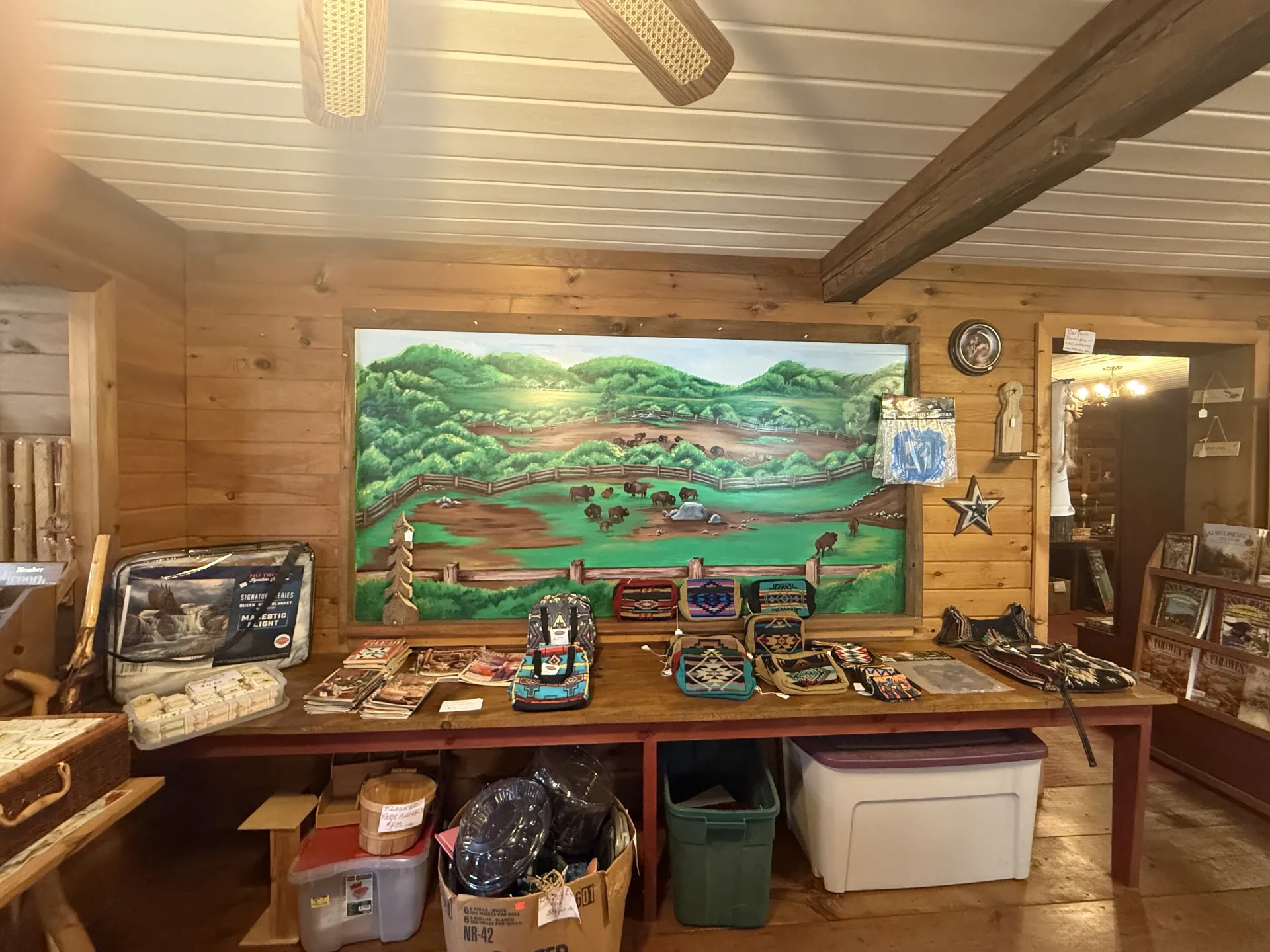 A large painting of the buffalo herd adorns a wall in the shop