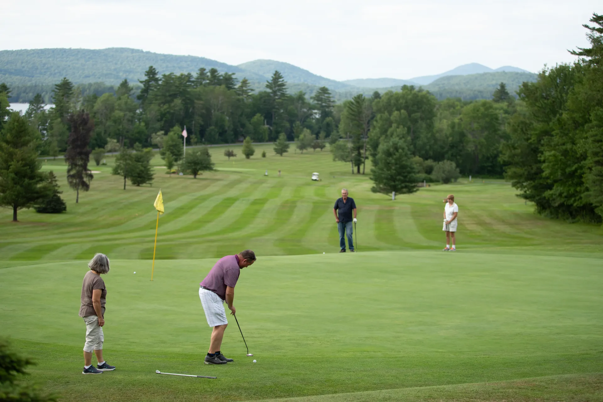 People golfing