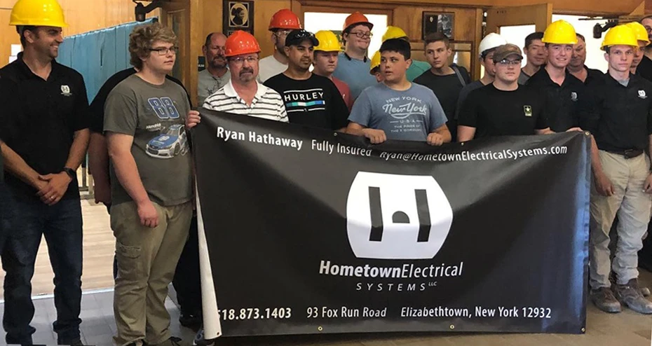 team holding up the banner