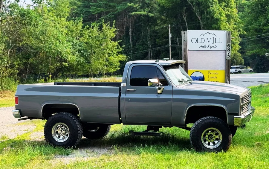 Truck outside in front of the Old Mill Sign