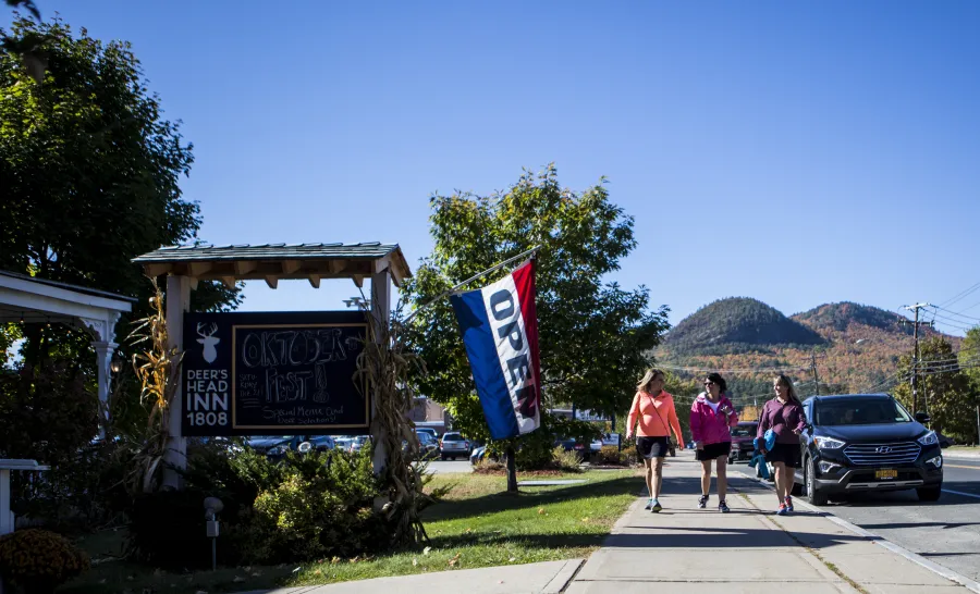 sign with mountains in the back 