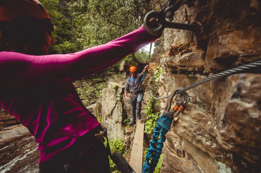 Experience the chasm from above harnessed to cables and walking wooden planks