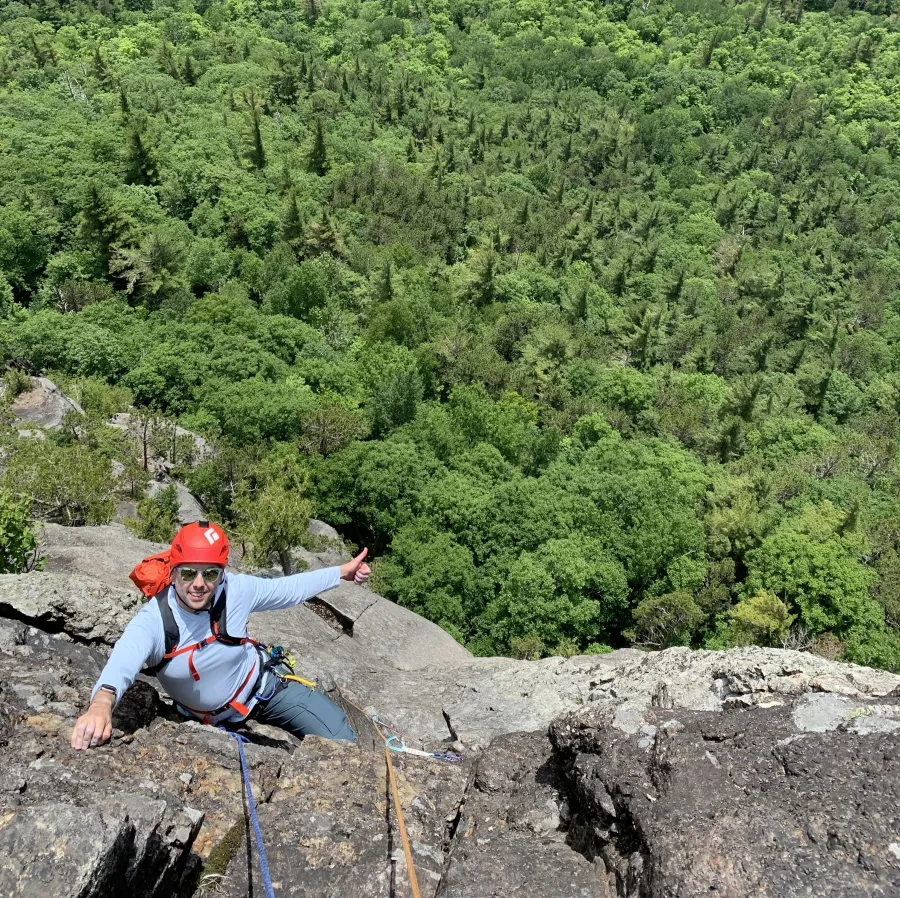 A climber gives a thumbs up 