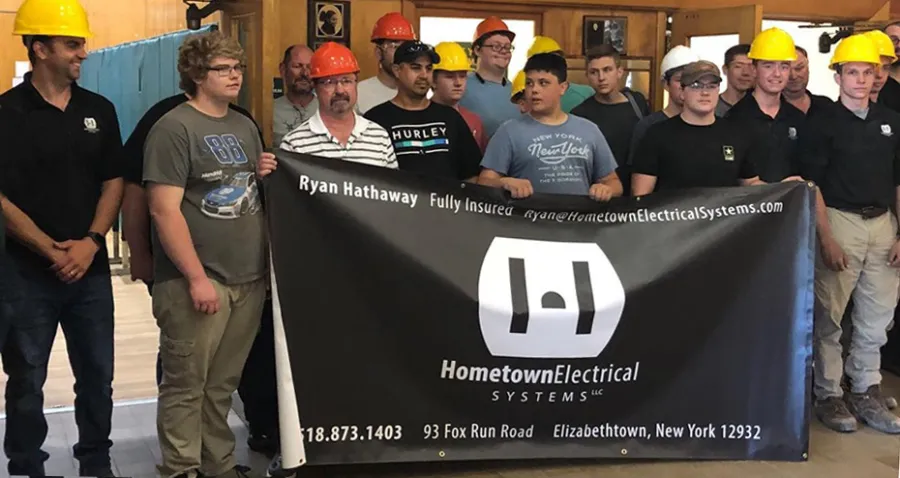 team holding up the banner